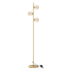 Lampadaire sur pied en métal doré avec 3 abat-jours globe verre